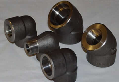 Steel pipe fittings: elbows, tees, couplings, and reducers in different sizes