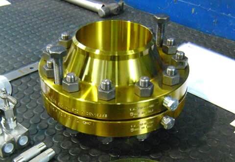 A brass pipe with a metal fitting on top, suitable for various purposes