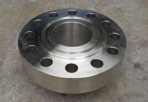 An aluminum flange with holes on the bottom, used for connecting pipes or valves