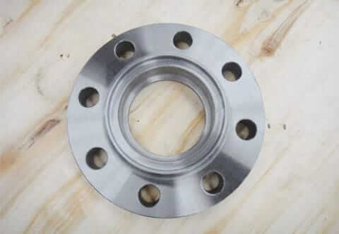 An aluminum flange with various holes and perforations for specific applications and fastening purposes